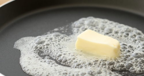 butter in a hot frying pan