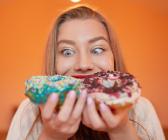 Image of person craving sugary donut.
